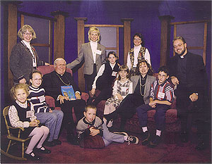 On floor: Charlie Smilie (Margaret MacDonald's son); Seated - Left to right: Rachael Schnitzer, Sire Smilie (Margaret MacDonald's daughter), Bishop John M. Smith, Kathleen Hanley, Teresa Hanley, Janice Cohn, Isaac Schnitzer, Rev. Jeffrey Lee; Standing - Left to right: Margaret MacDonald, Tammie Schnitzer and Marilyn Hanley.